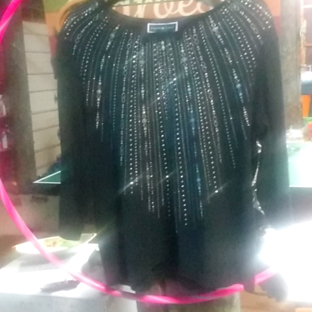 Black blouse with silver bling studs. Size XL.